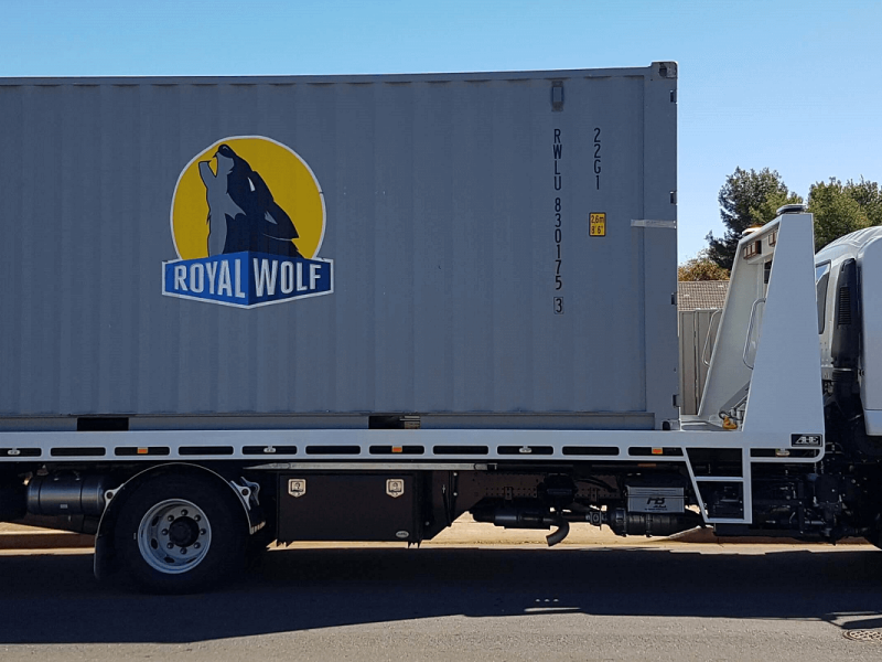 Black Wolf Shipping Container Being Transported On Our Tow Truck